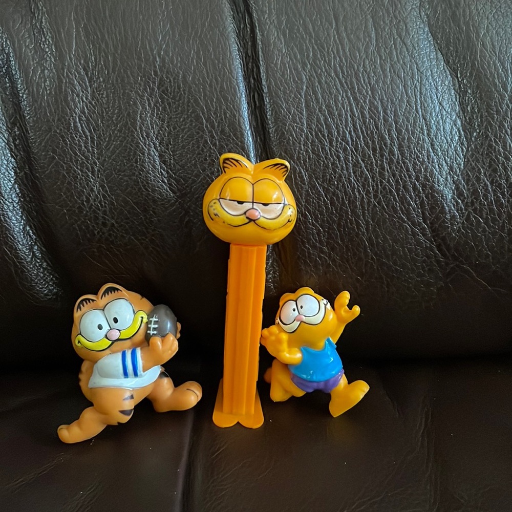 Garfield vintage Pez dispenser and two figures.